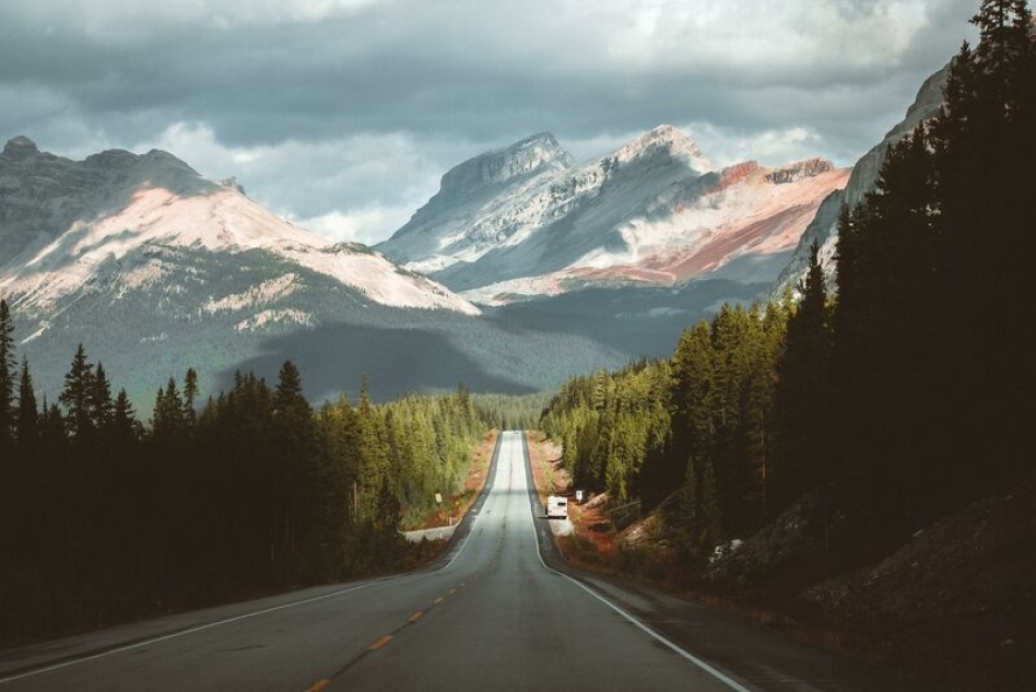 road driving towards a mountain